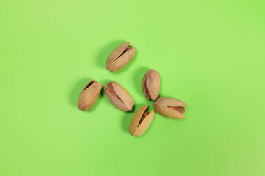 pistachios on a green background close-up macro