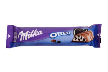 Magdalinovka, Ukraine - February 16, 2022. Milka alpine milk chocolate bar with Oreo cookie toppings isolated on white