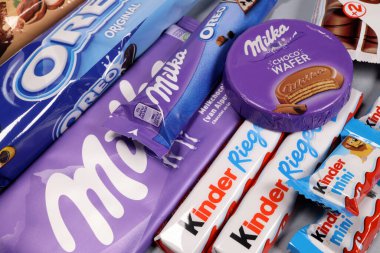 Magdalinovka, Ukraine - February 16, 2022. Chocolate bars and sweets from famous brands Milka, Kinder