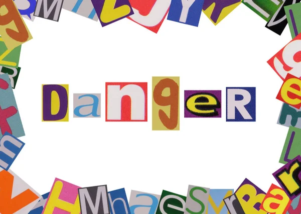 word danger from cut newspaper letters in a frame of magazine letters