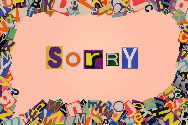 word sorry from cut newspaper letters into a speech bubble from magazine letters