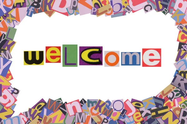 Word Welcome from cut newspaper letters into a speech bubble from magazine letters