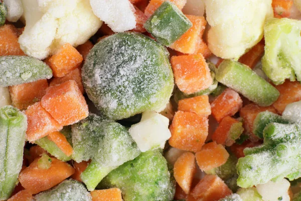 Hintergrund Der Gefrorenen Gemüsemischung Mit Karotten Spargelbohnen Brokkoli lizenzfreie Stockfotos