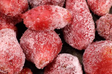 Donmuş çileklerin arka planı yakın plan.