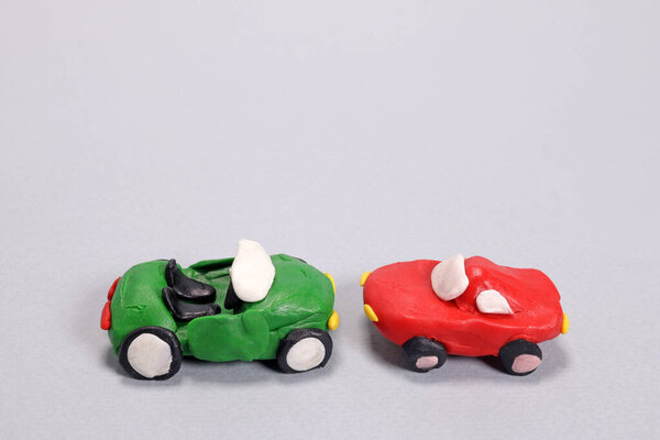 plasticine cars crashed into each other, accident concept, auto insurance payouts. Copyspace for your text