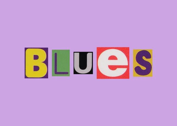 Blaues Wort Aus Ausgeschnittenen Farbigen Buchstaben — Stockfoto