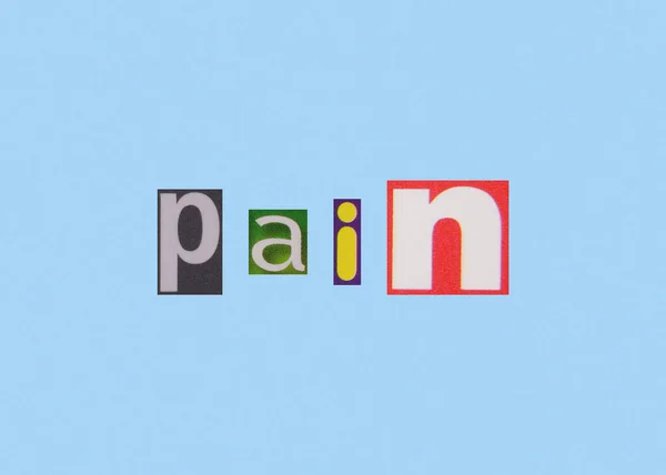 Λέξη Πόνου Από Κομμένα Χρωματιστά Γράμματα Περιοδικών — Φωτογραφία Αρχείου