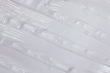 Vücut veya yüz bakımı için beyaz krem yakın plan, doku