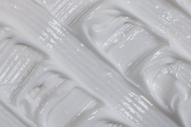 Vücut veya yüz bakımı için beyaz krem yakın plan, doku