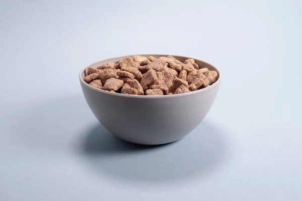 Stock image Chocolate corn snacks pads, dry breakfast in a bowl on a gray background