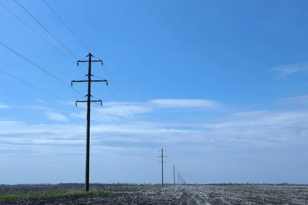 High voltage power line against the blue sky. copy space for text