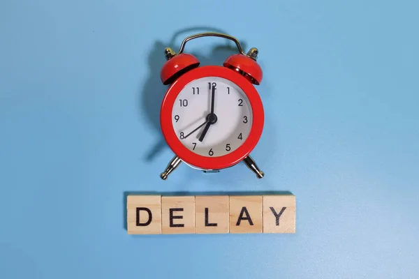 Delay Word Alarm Clock Blue Background — Stock Photo, Image