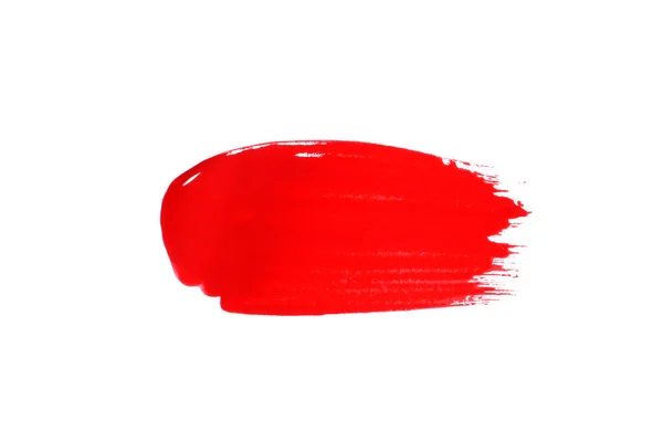 Kırmızı kozmetik ürün fırça darbesi sürme örneği beyaz üzerine izole