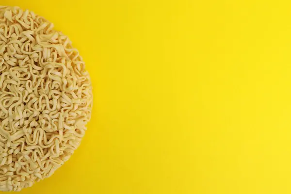 stock image Dry instant noodles vermicelli on yellow background. copy space for text