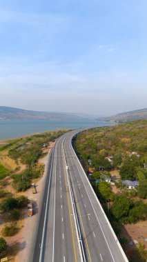 The M6  motorway Expressway Nakhon Ratchasima Province - Bang Pa-in. Lam Ta Khong River and Mountain. Drone shot of scenic landscape rural place traffic. Nakhon Ratchasima Thailand. Motorway Korat clipart