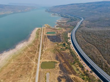 Drone shot The M6  motorway Expressway Nakhon Ratchasima Province - Bang Pa-in. Lam Ta Khong River and Mountain. Drone shot of scenic landscape rural place traffic. Nakhon Ratchasima Thailand. Motorway Kora clipart