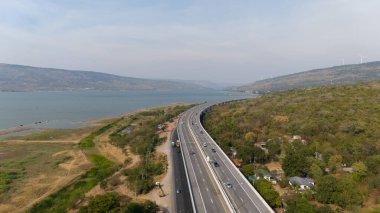 The M6  motorway Expressway Nakhon Ratchasima Province - Bang Pa-in. Lam Ta Khong River and Mountain. Drone shot of scenic landscape rural place traffic. Nakhon Ratchasima Thailand. Motorway Korat clipart