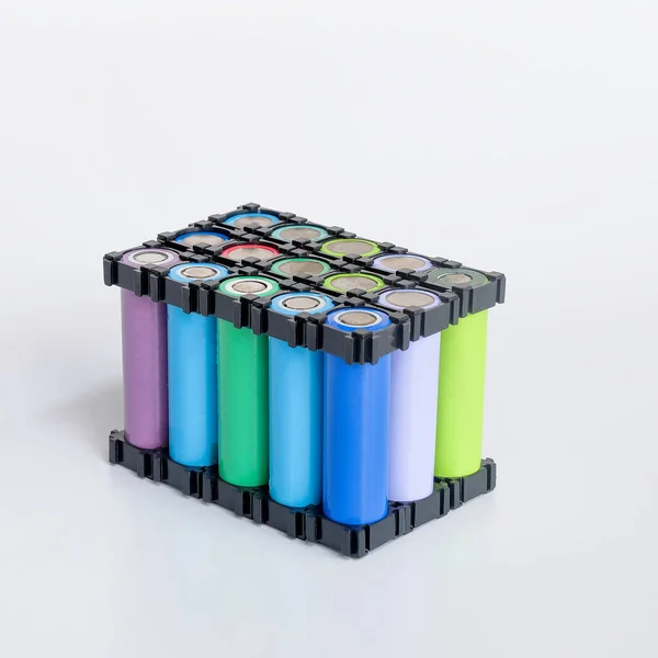 stock image Reused Li ion 18650 battery pack in holder on white.