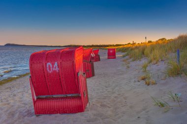 German Baltic Sea coast, seaside beach Beach chairs Coast Ruegen Island (Moenchgut) Lobbe between Thiessow and Goehren white sandy beach on the dune in the evening light quiet beach life summertime clipart