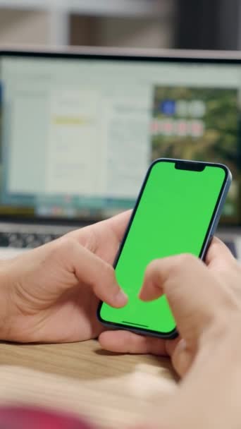 Man Using Smartphone Vertical Mode Green Mock Screen Doing Swiping — Stockvideo
