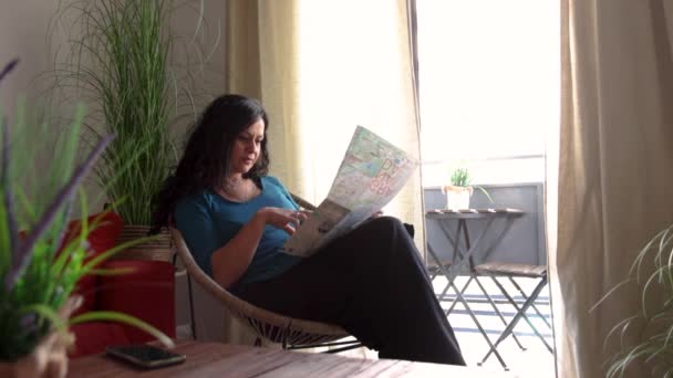Woman Vacation Apartment Sitting Looking Map City — Stock Video