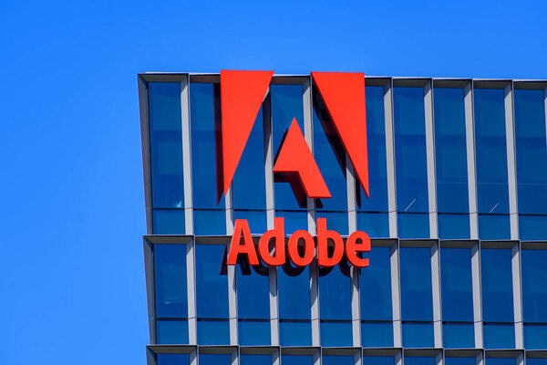 Adobe sign, logo on the facade of corporate headquarters building. - San Jose, California, USA - September 15, 2024