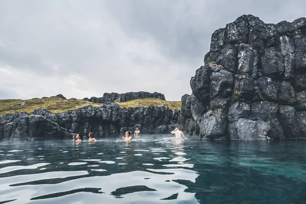 Reykjavik, Iceland - July 17 2022: Sky Lagoon in Iceland. Tourists enjoying geothermal spa with heated water during cold day