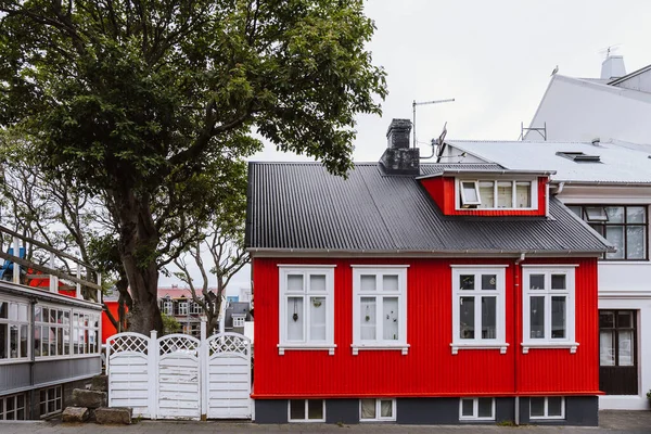 Front of a house painted red in the center of Reykjavik, Iceland
