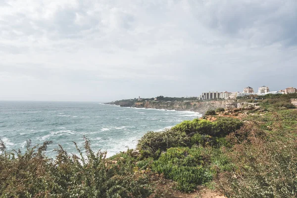 stock image Coastline with atlantic ocean in Cascais, Portugal. Waves at the shore and rocky hills