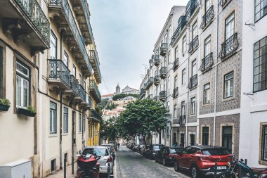 Lisbon, Portugal - March 5, 2023: Beautiful street view with beautiful residential buildings in Mouraria district in Lisbon, Portugal clipart