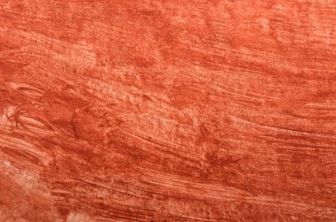 Fırça darbeleriyle kırmızı-turuncu lekelerin basit sanat arkaplanı