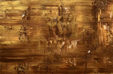 Altın ve kahverengi fırça darbeleriyle kirli sanat arkaplanı