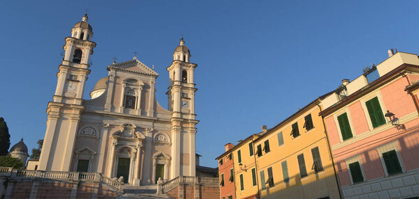 The Basilica of Santo Stefano a Lavagna is a masterpiece of marble, balustrades, stairways, churchyards and lions among the colorful gloomy houses of Piazza Marconi