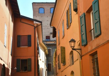 Bologna is full of picturesque, brightly colored buildings, especially red ones. In fact, Bologna is the red city in whose streets full of arcades one walks pleasantly. clipart