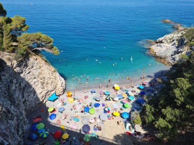 Cala degli Inglesi also called Transilvania beach is one of the most beautiful coves in Liguria also for the blue color of the sea. clipart