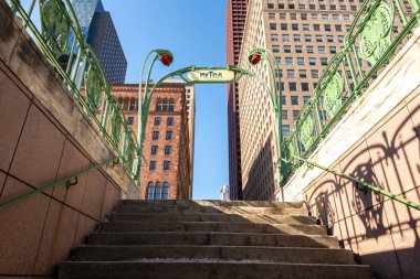 Chicago, Illinois, USA - January 13th 2025:  Retro copy of a 1900's Paris metro station entrance at the Van Buren Metra station in Chicago. clipart