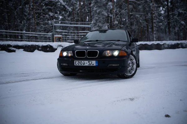 2022 Riga Latvia Black Car Parked Snowy Road Snow Trees — Stock Photo, Image