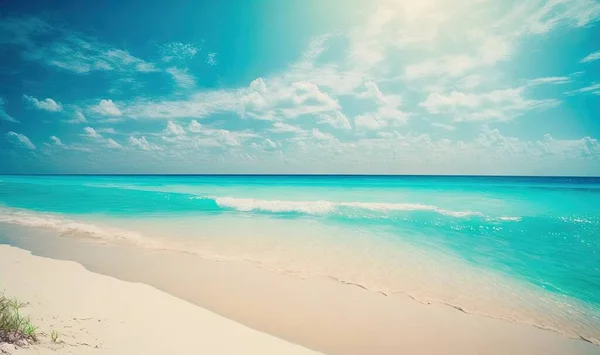 a sandy beach with a blue sky and ocean in the background.