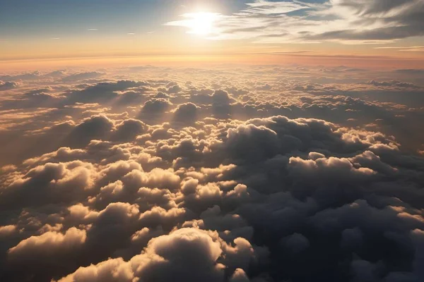 the sun is shining through the clouds in the sky over the ocean of clouds in the ocean of clouds is the sun shining through the clouds in the sky above the clouds.