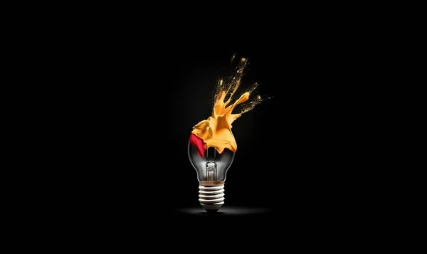 a light bulb with a flame coming out of it's side on a black background with a red and yellow flame coming out of it.