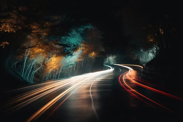 a long exposure photo of a road at night with light streaks on the road and trees on the side of the road and the road.