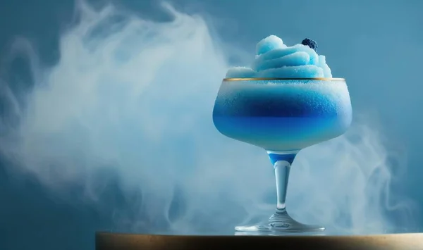 a blue drink with a blue substance in a glass on a table.