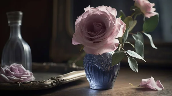 a blue vase with pink roses in it on a table.