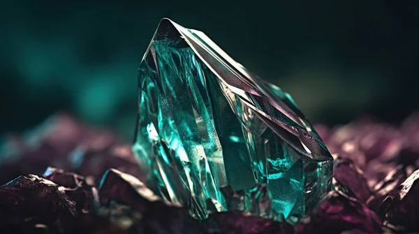 a green diamond sitting on top of a pile of rocks.