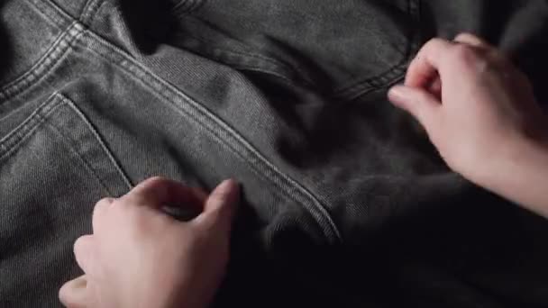 Shopper Checking Black Jeans Touches Hand Fabric Checking Quality Buying — Stockvideo