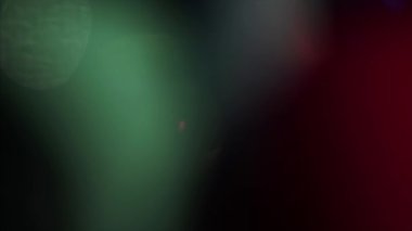 Moving rainbow effect futuristic fashion holographic background in green and red colors. 4k video for any kind of project. 