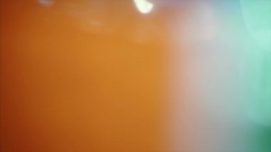 Colorful neon nostalgic psychodelic glittering background. Orange and turquoise green color. Video fx for creative use. 