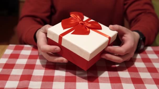 Man Holds Gift Holiday Cardboard Box Red Ribbon Bow Mens — Αρχείο Βίντεο