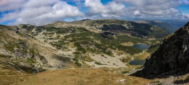 Panoramic view of Galcescu and Vidal lake in the Parang mountains, Romania.  clipart