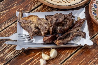 Traditional menu with mutton pastrami on a wooden table. clipart